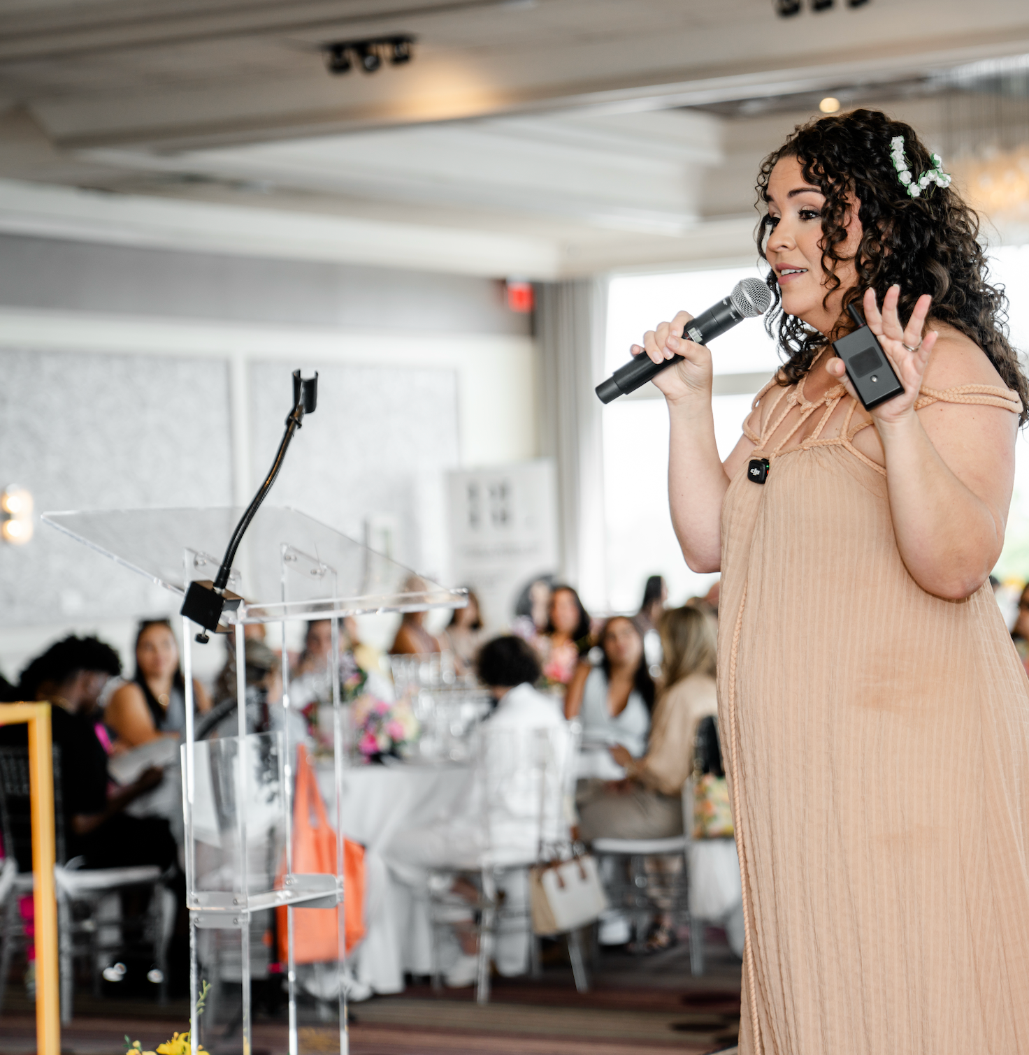 GiGi Diaz speaking on stage